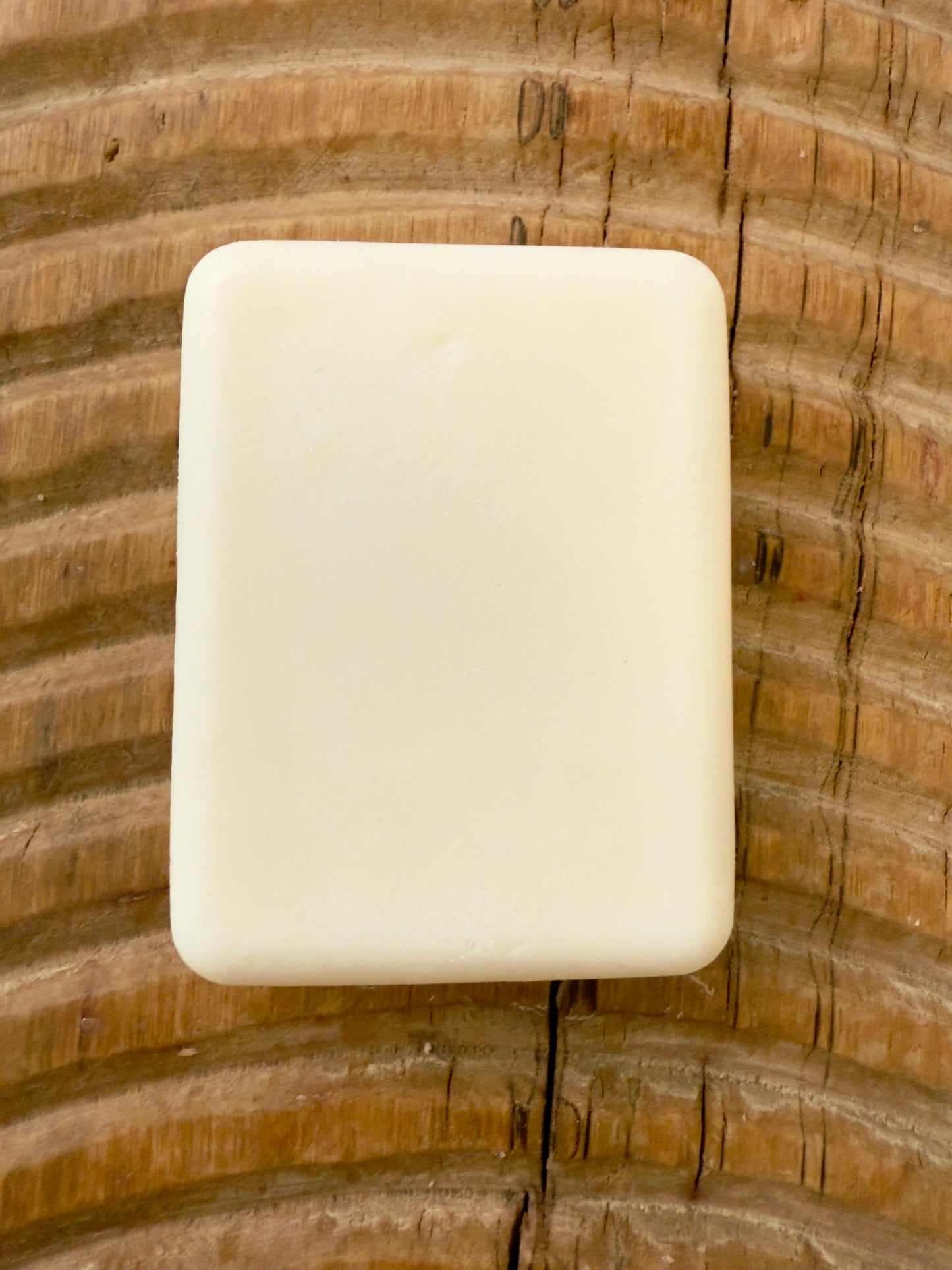 “Coconut Cream solid shampoo bar in rectangular shape, pearly white finish, handcrafted by Panta Rei Made.”