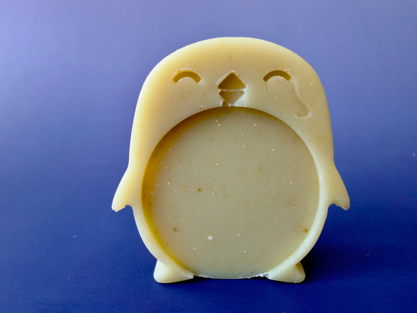 Chamomile baby soap molded as a penguin with a rounded belly