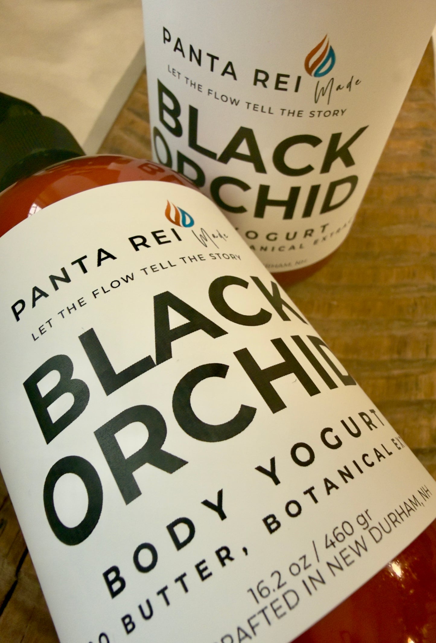 Close-up of Black Orchid body yogurt label showing product name and brand logo
