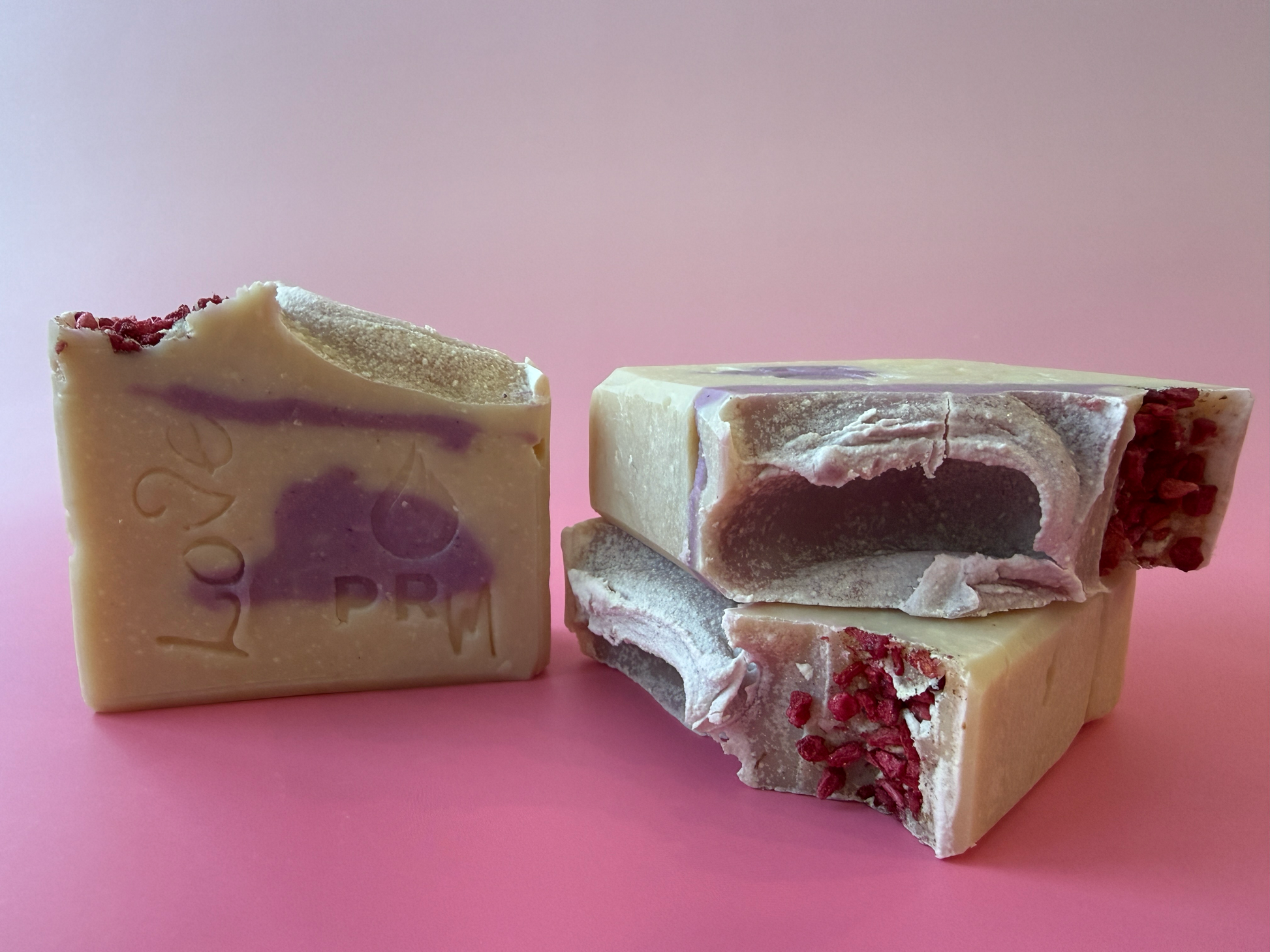 Fresh Blossoms small batch beef tallow soap with pink swirl and freeze-dried cranberry topping.