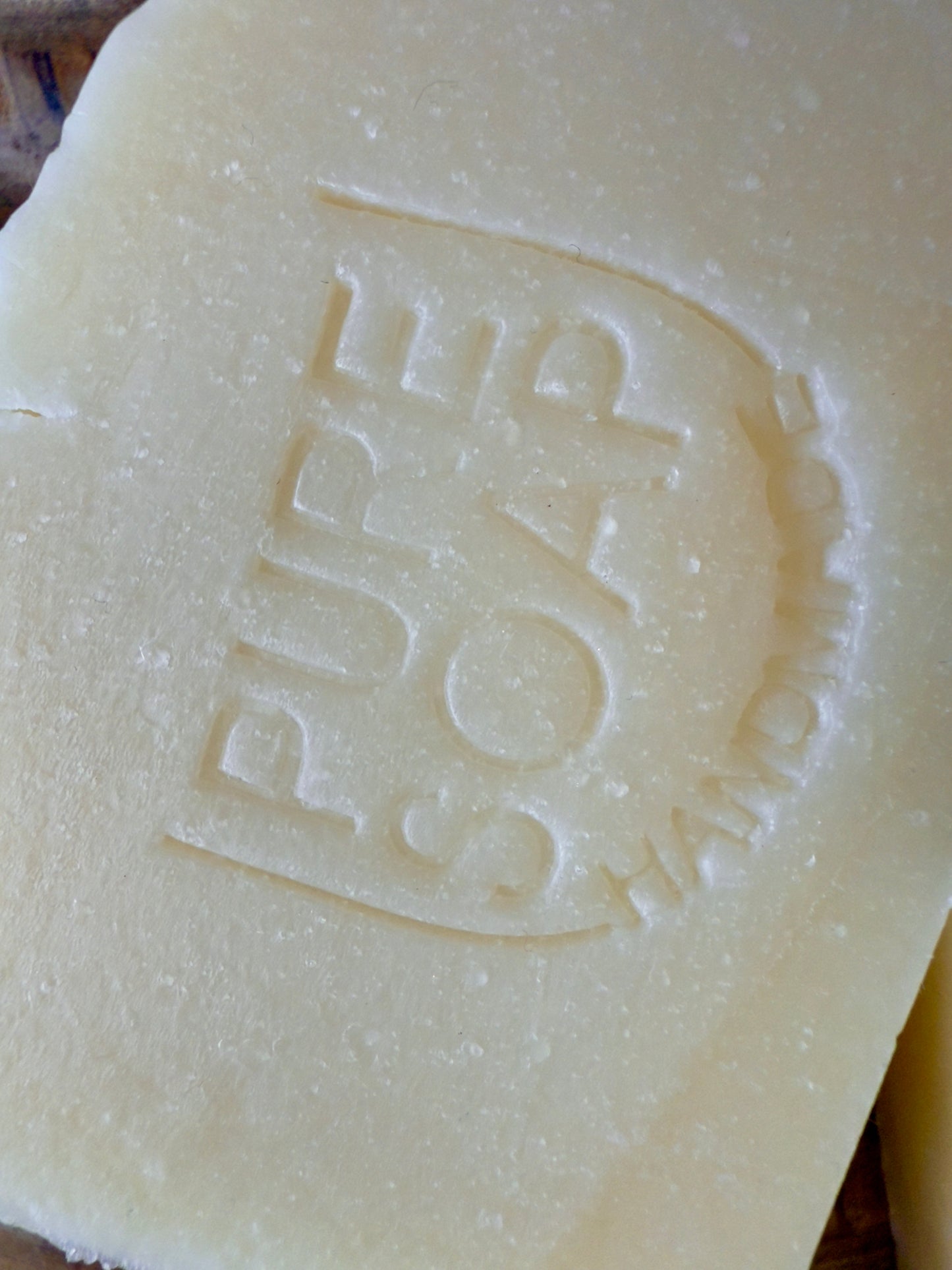 Creamy beige apple-sage soap bar with light speckles and a clean, rustic edge.