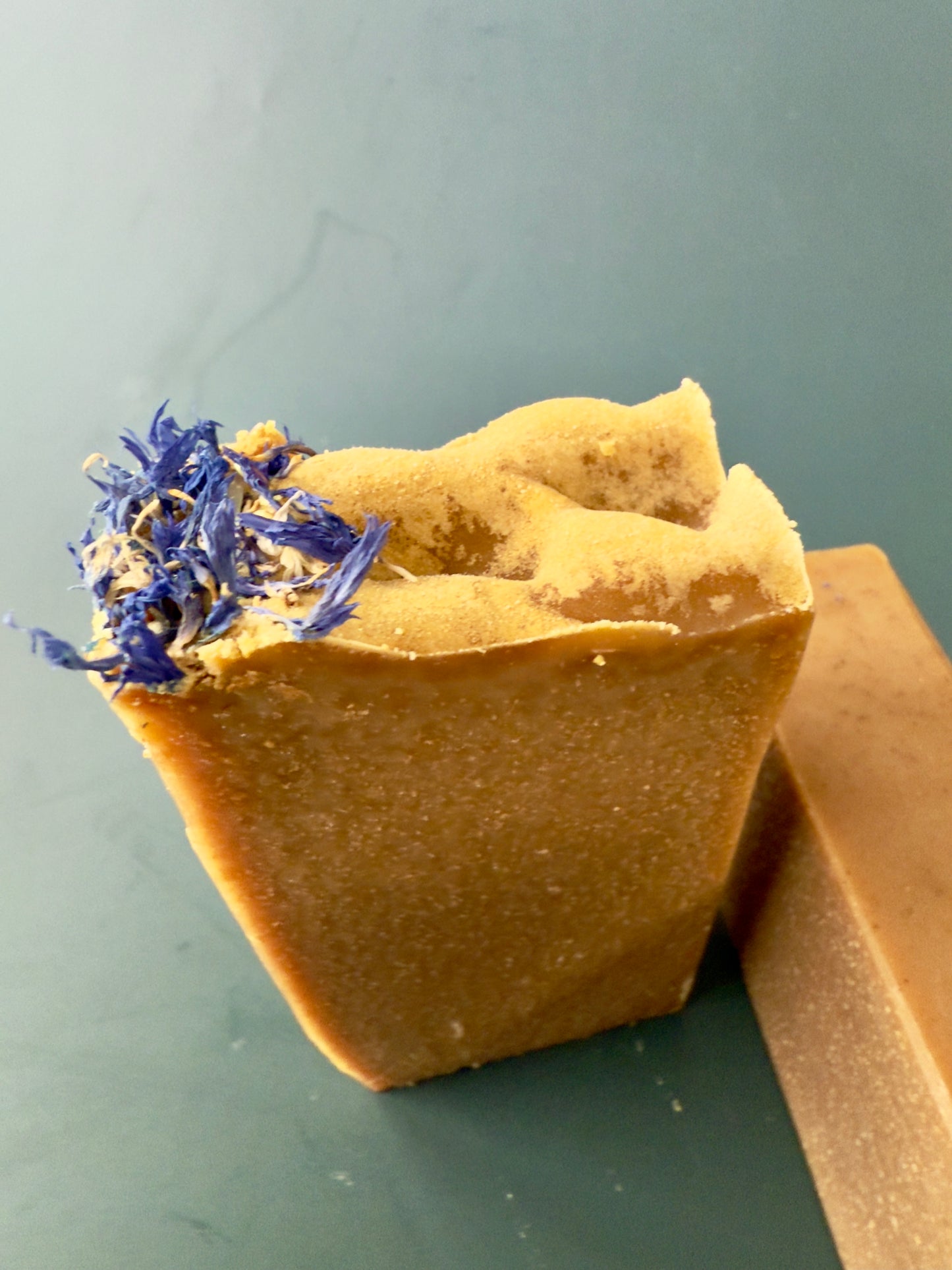 Blue Butterfly cold process soap with cornflower petals on top, shown in large and small bar sizes.