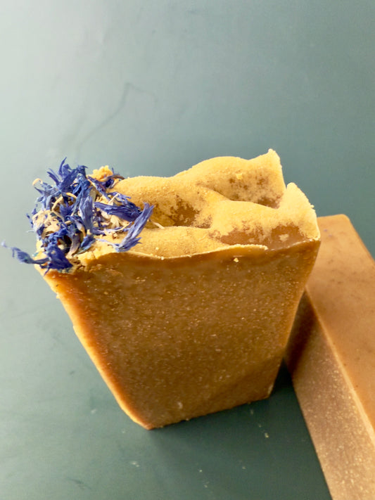 Blue Butterfly cold process soap with cornflower petals on top, shown in large and small bar sizes.