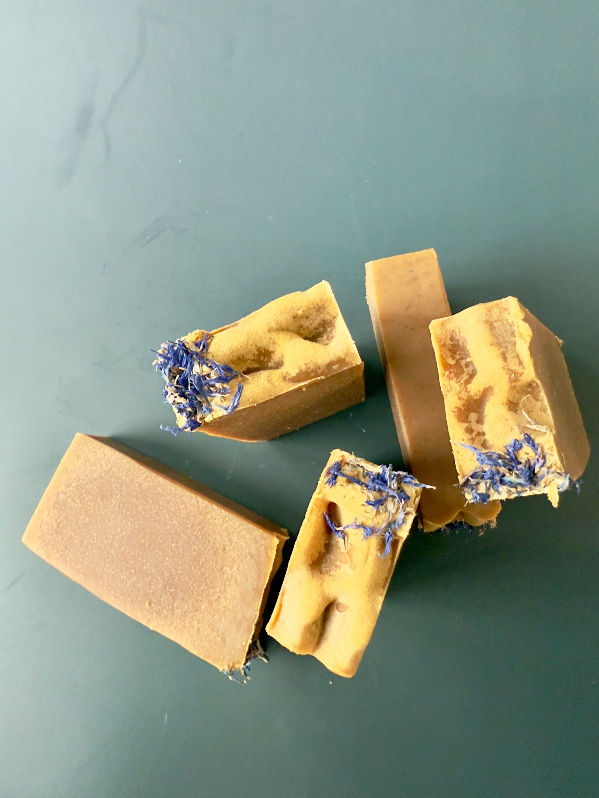Blue Butterfly cold process soap with cornflower petals on top, shown in large and small bar sizes.