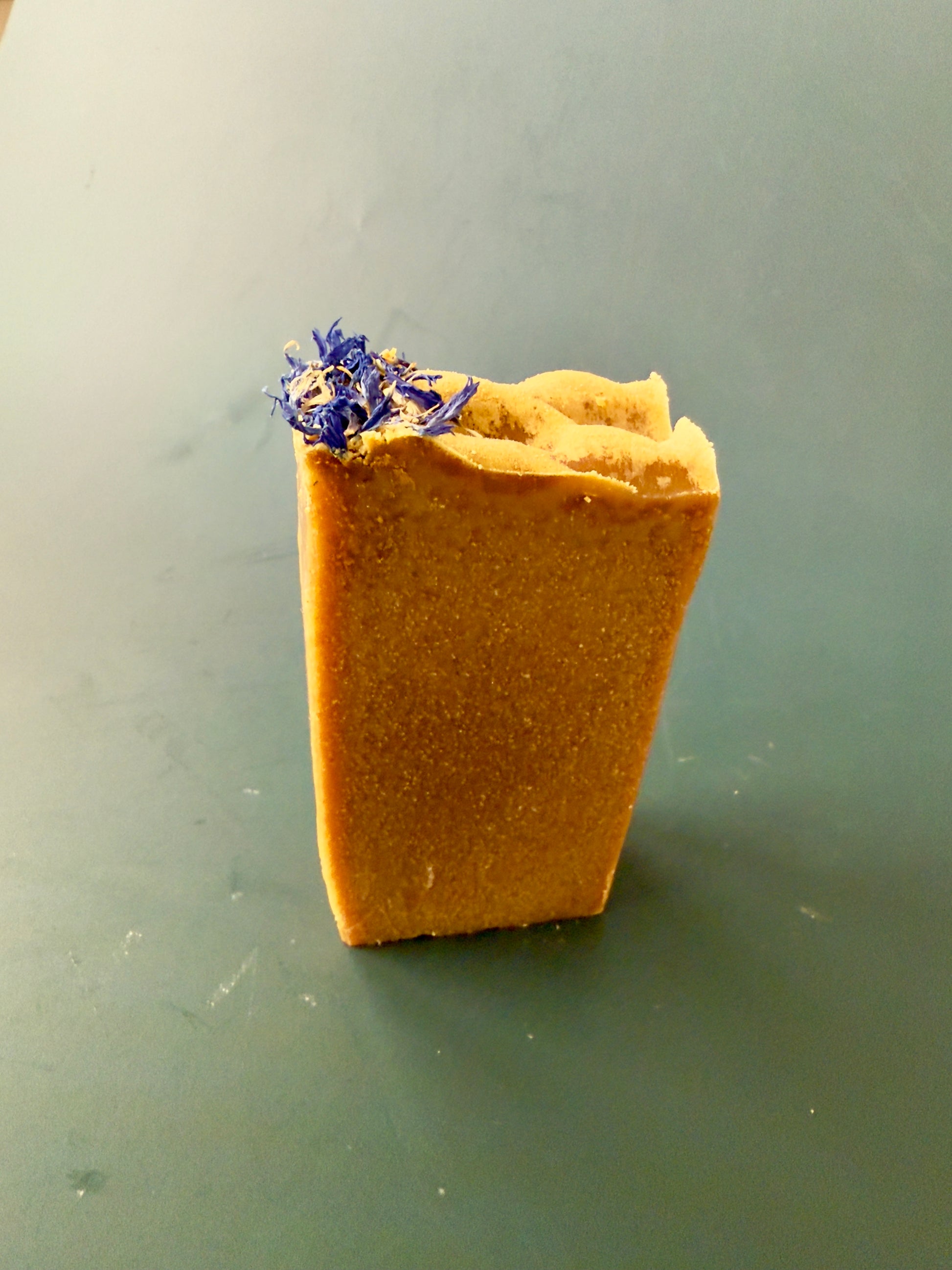 Blue Butterfly cold process soap with cornflower petals on top, shown in large and small bar sizes.