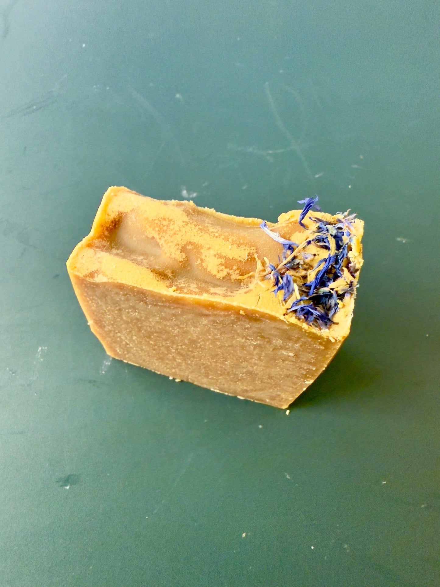 Blue Butterfly cold process soap with cornflower petals on top, shown in large and small bar sizes.