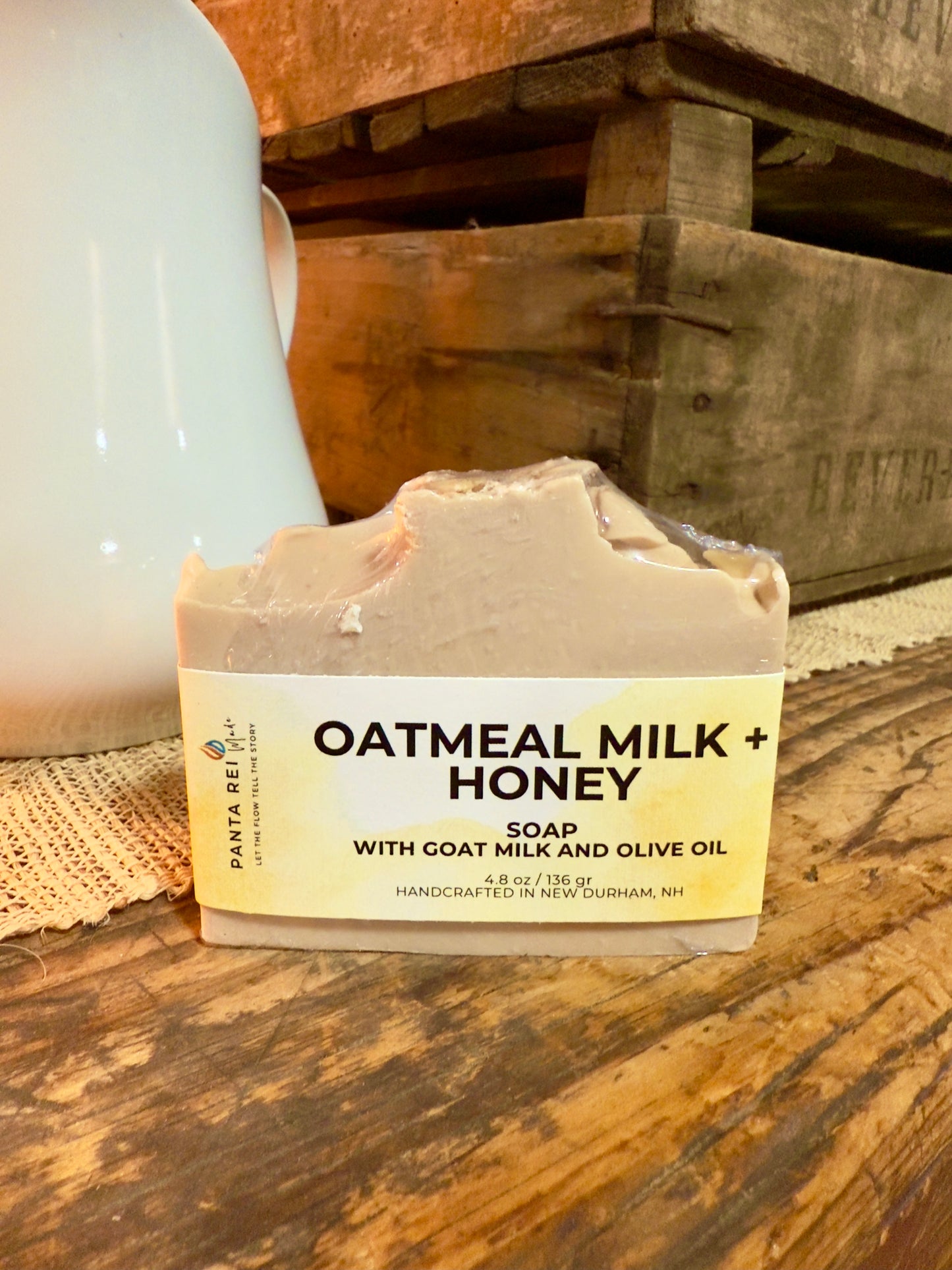Bar of oatmeal milk and honey soap on a wooden surface with a rustic background
Loaf-cut Oatmeal Milk and Honey soap bar with a warm beige tone and subtle oat specks.