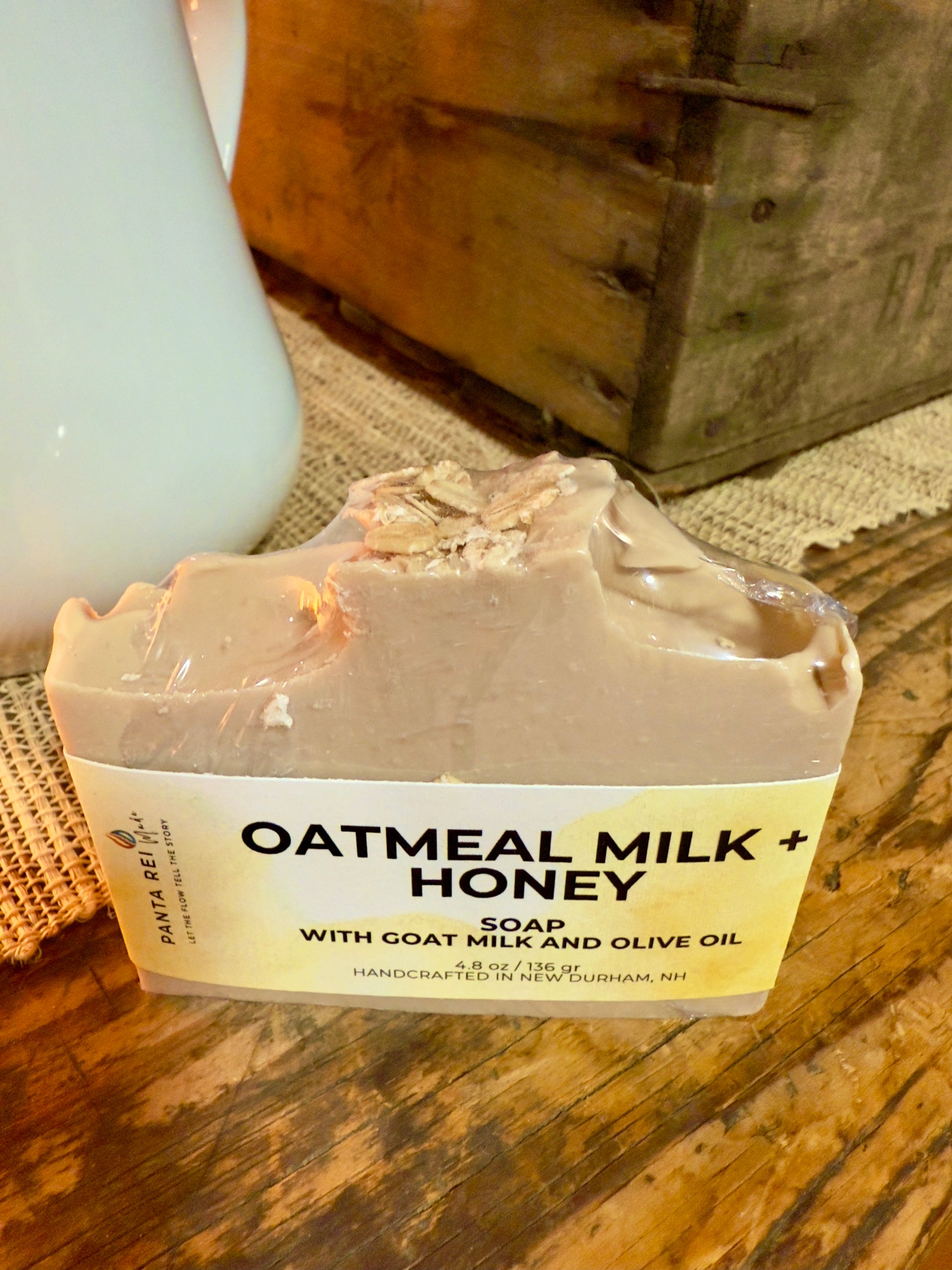 Bar of oatmeal milk and honey soap on a wooden surface with a rustic background
Loaf-cut Oatmeal Milk and Honey soap bar with a warm beige tone and subtle oat specks.