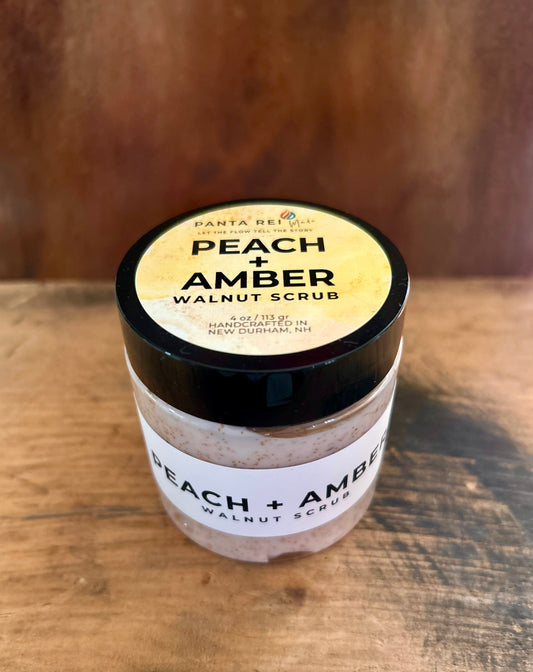 Peach + Amber Walnut Scrub in a jar with creamy texture and walnut powder