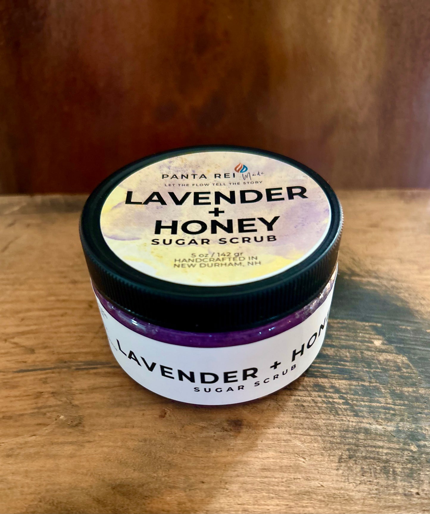 Lavender + Honey Sugar Scrub in a jar with purple hue
