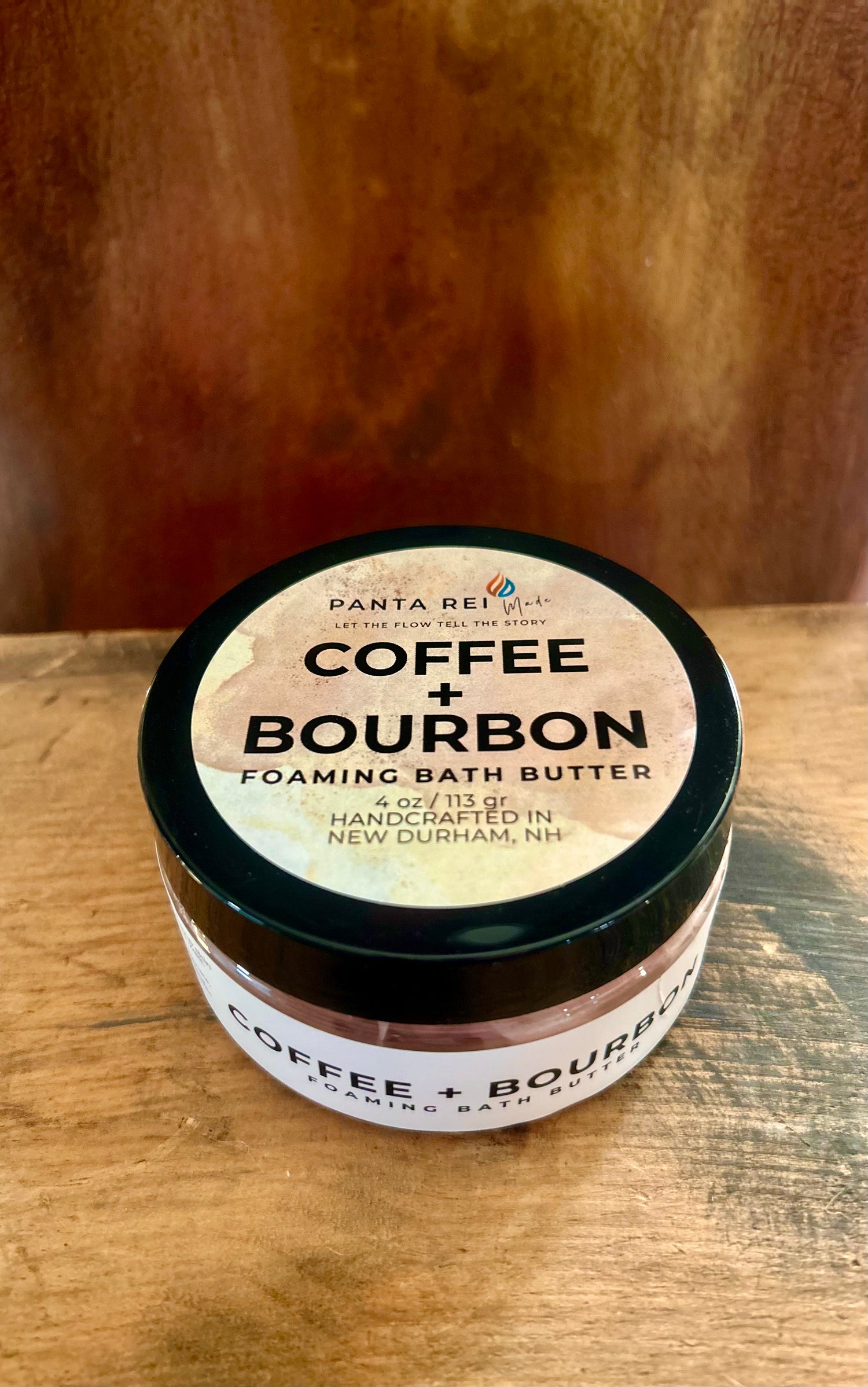 “Coffee + Bourbon Soap Soufflé in a clear jar with warm brown whipped texture and copper shimmer.”