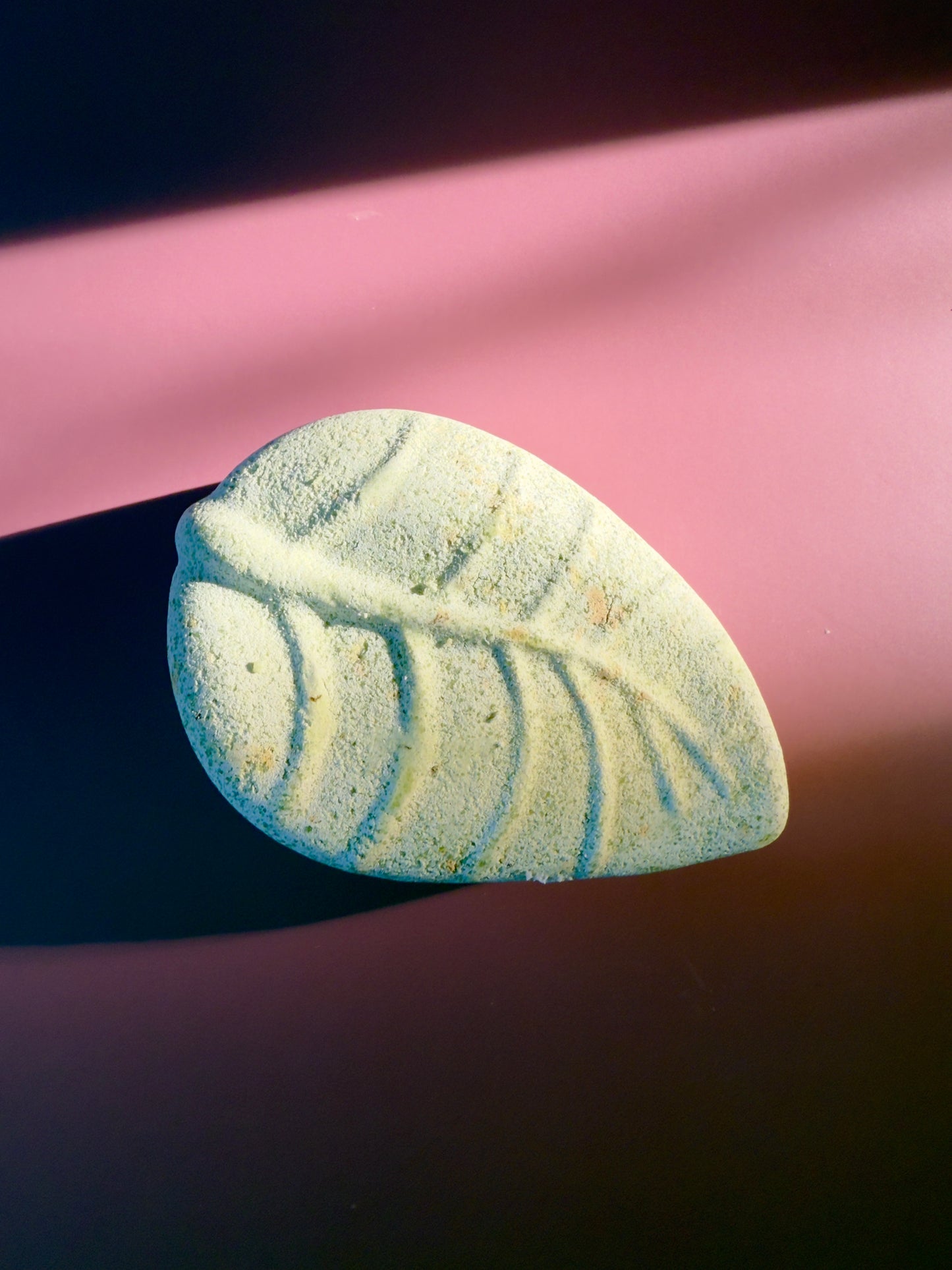 Leaf-shaped tallow soap with natural green tone, spearmint leaf texture, and a matte herbal finish