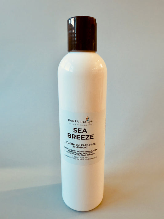 White bottle with black cap labeled Sea Breeze sulfate-free shampoo.
