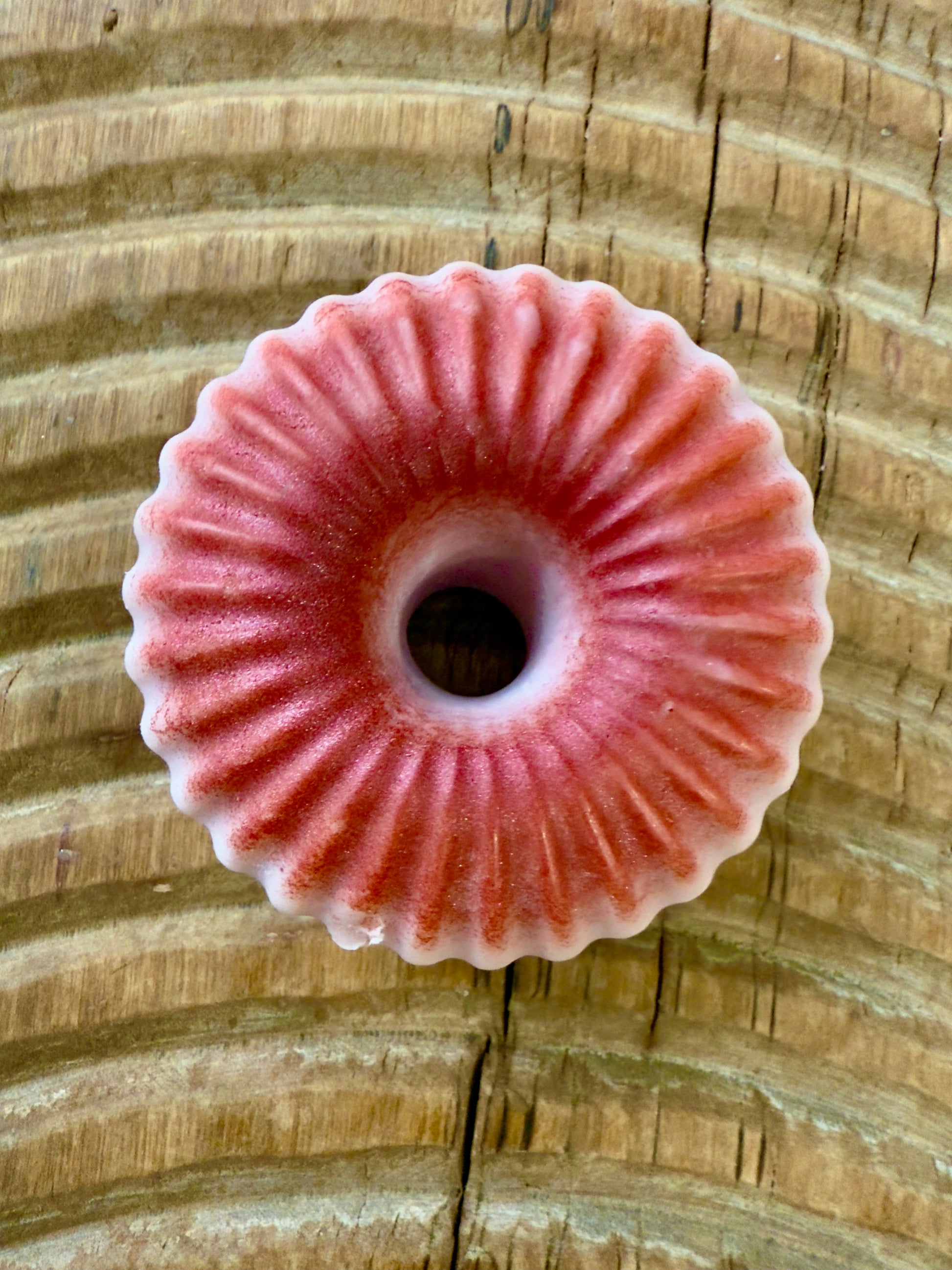 “Cherry solid shampoo bar in ridged donut shape with red merlot mica finish.”