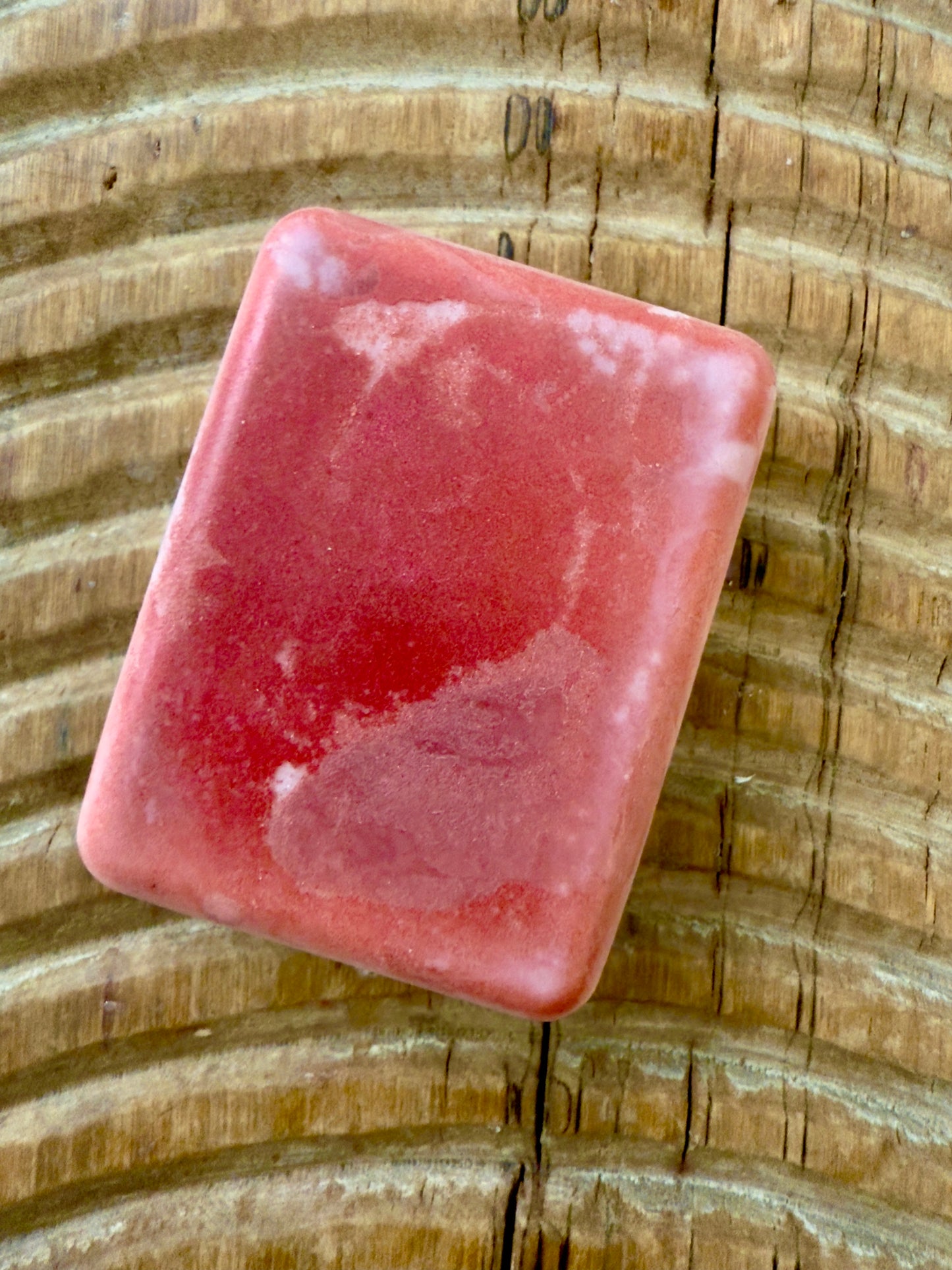 “Rectangular cherry shampoo bar with red marbled mica details.”