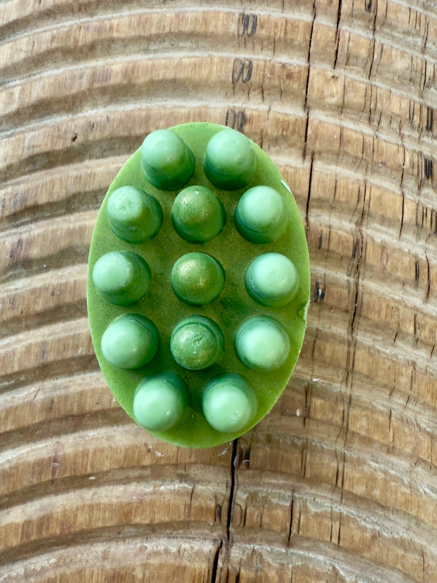 Green solid shampoo bar with massage bumps