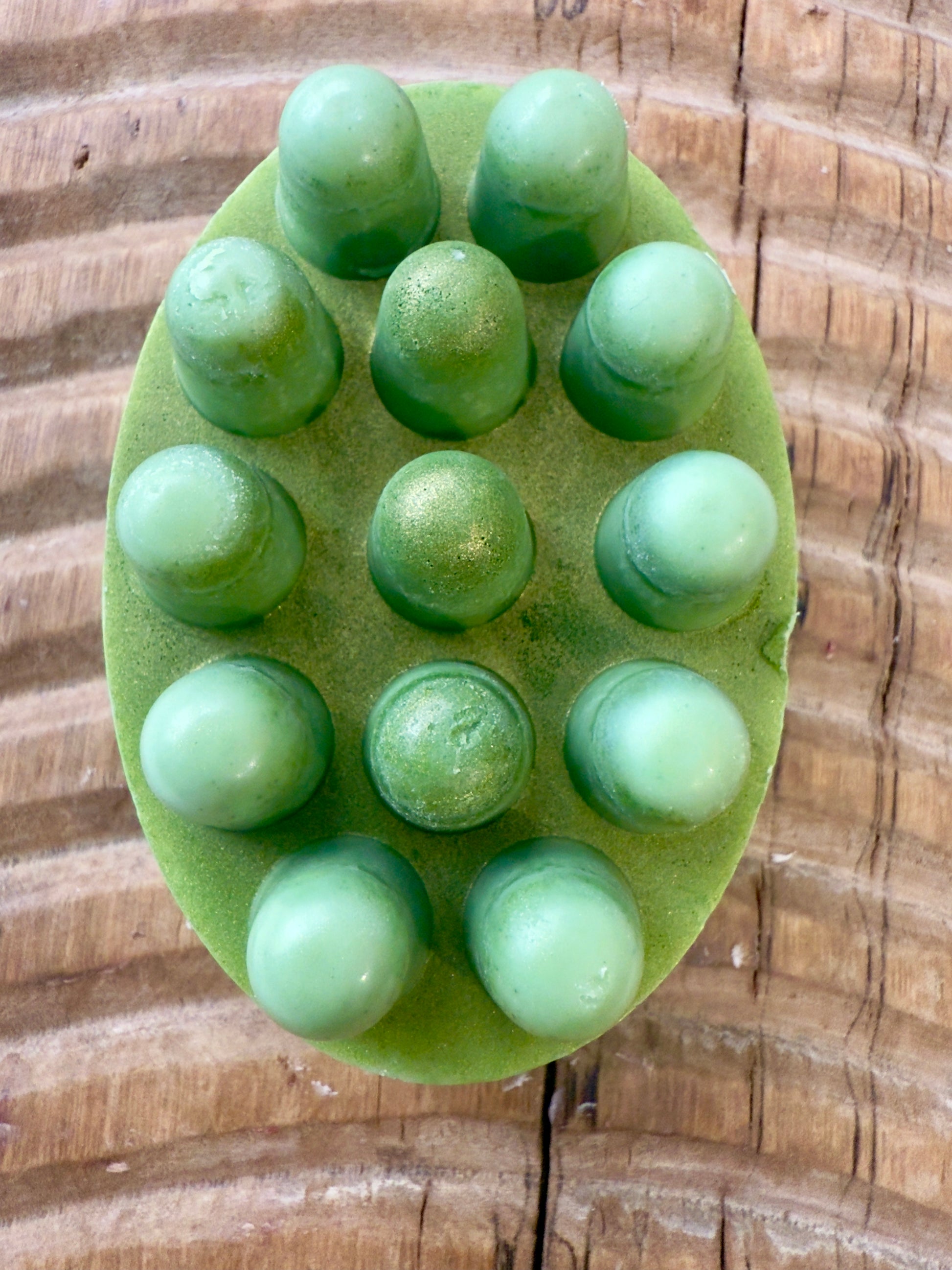 Close-up of green shampoo bar showing texture and mica sheen
