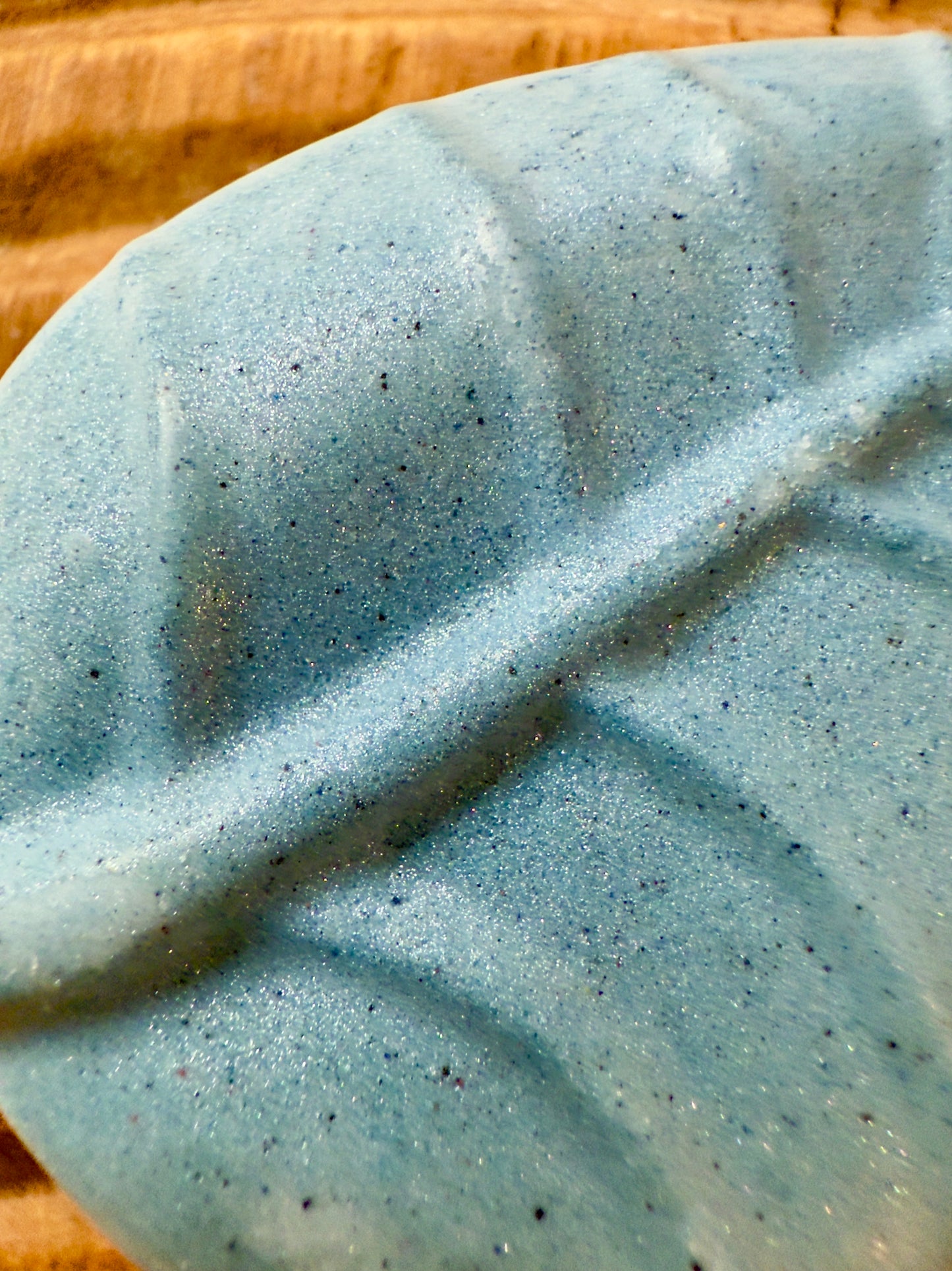 Leaf-shaped chamomile lavender shampoo bar in stormy blue with subtle shimmer.