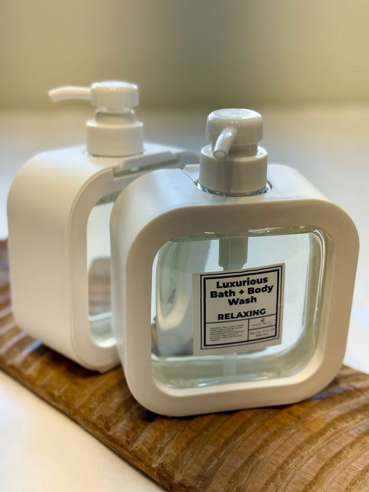 Relaxing Bath + Body Wash – two-bottle display on wood board