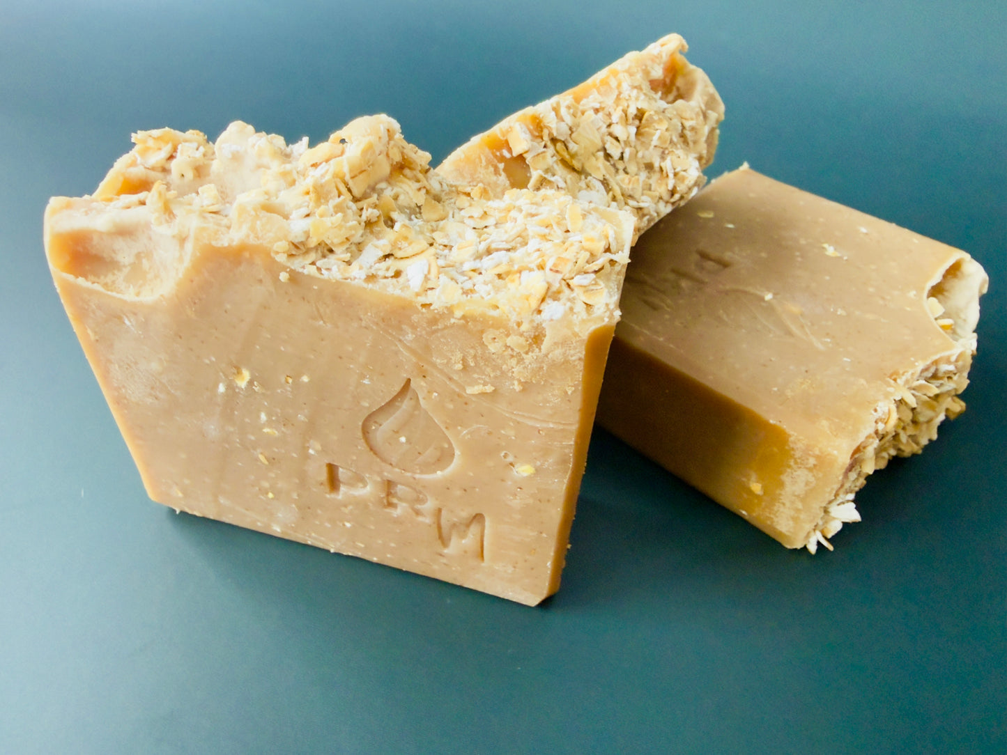 Three Honey Almond bars stacked, highlighting oat topping and smooth cut edges