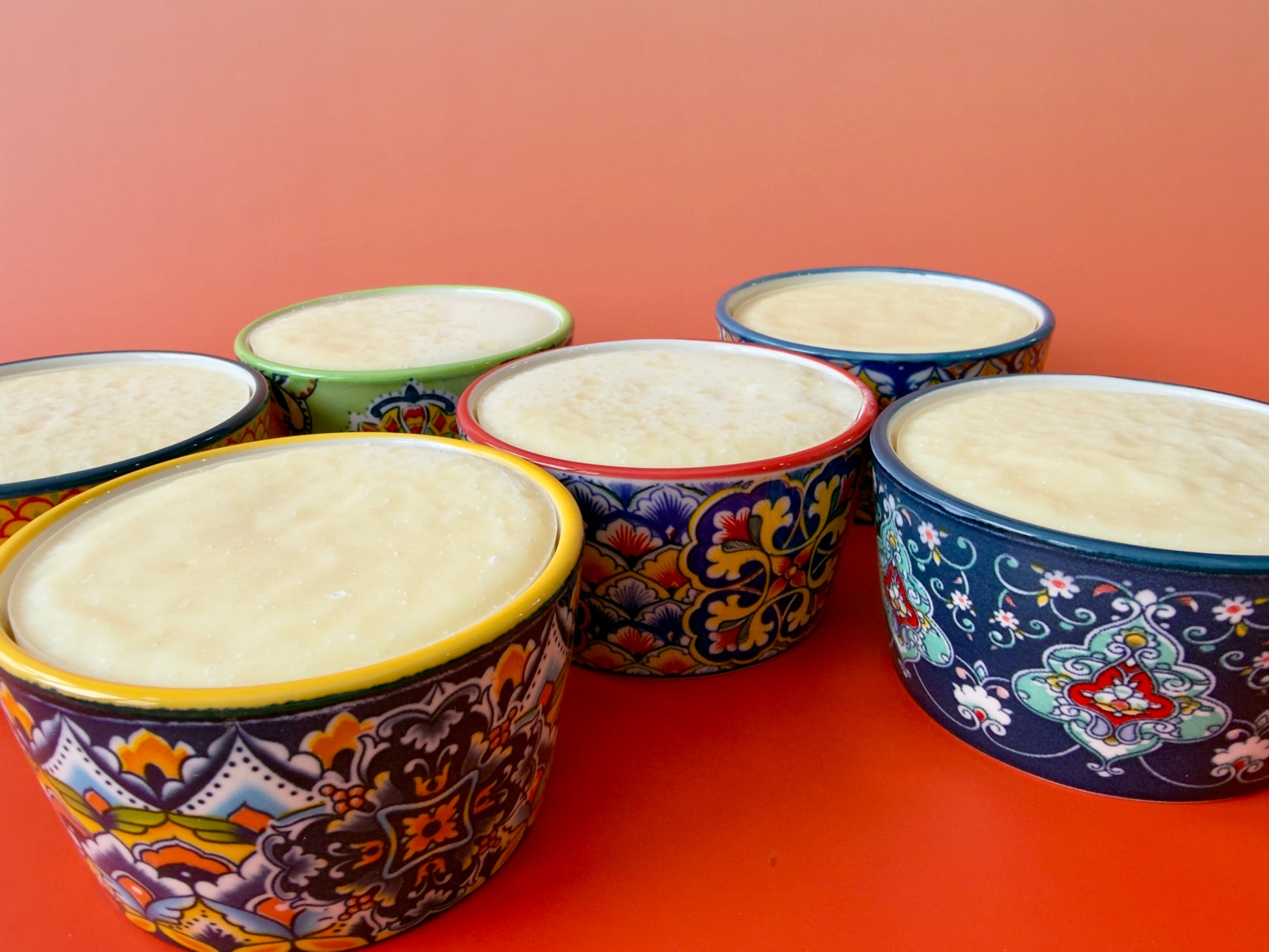Group of Citrus Burst dish soaps in assorted ceramic ramekins, viewed from above
