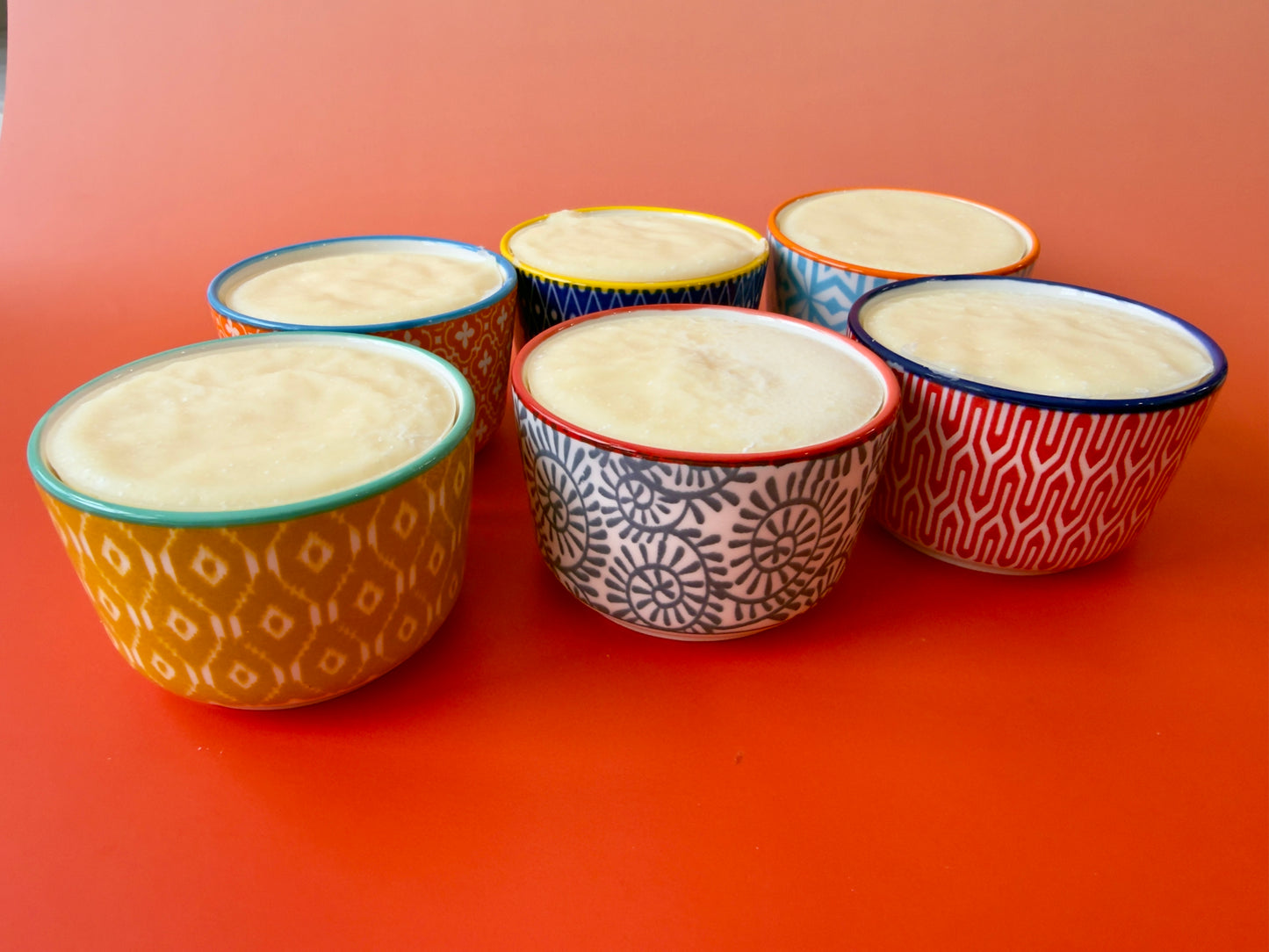 Multiple ramekins arranged together, showing variation in dish designs and colors