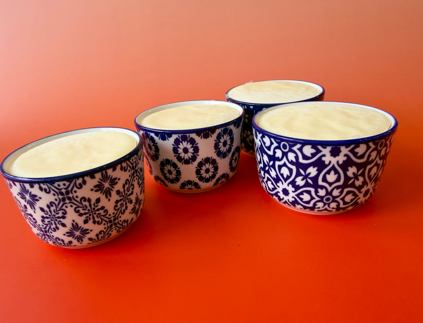 Close grouping of ramekins emphasizing reusable ceramic containers and clean presentation