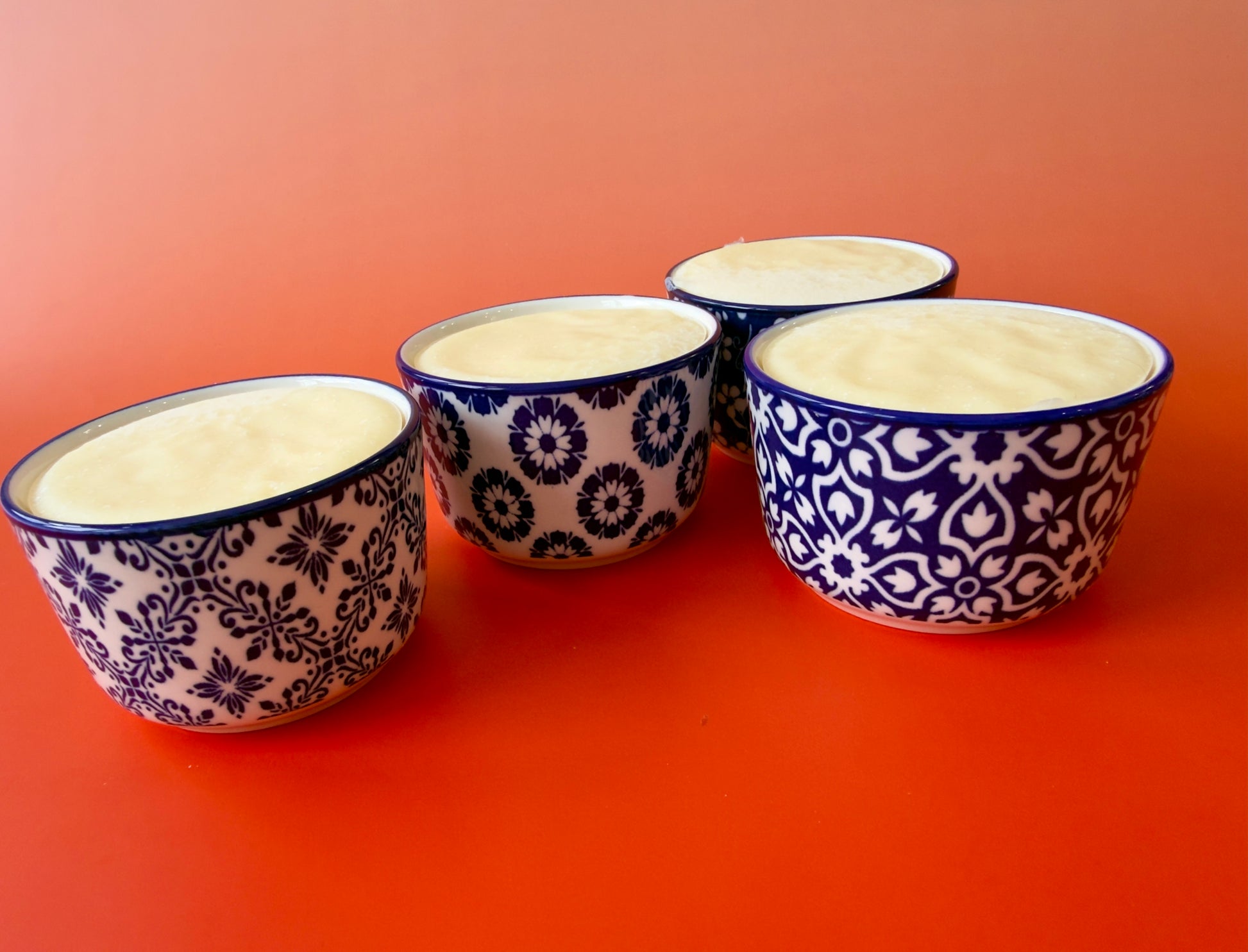Close grouping of ramekins emphasizing reusable ceramic containers and clean presentation