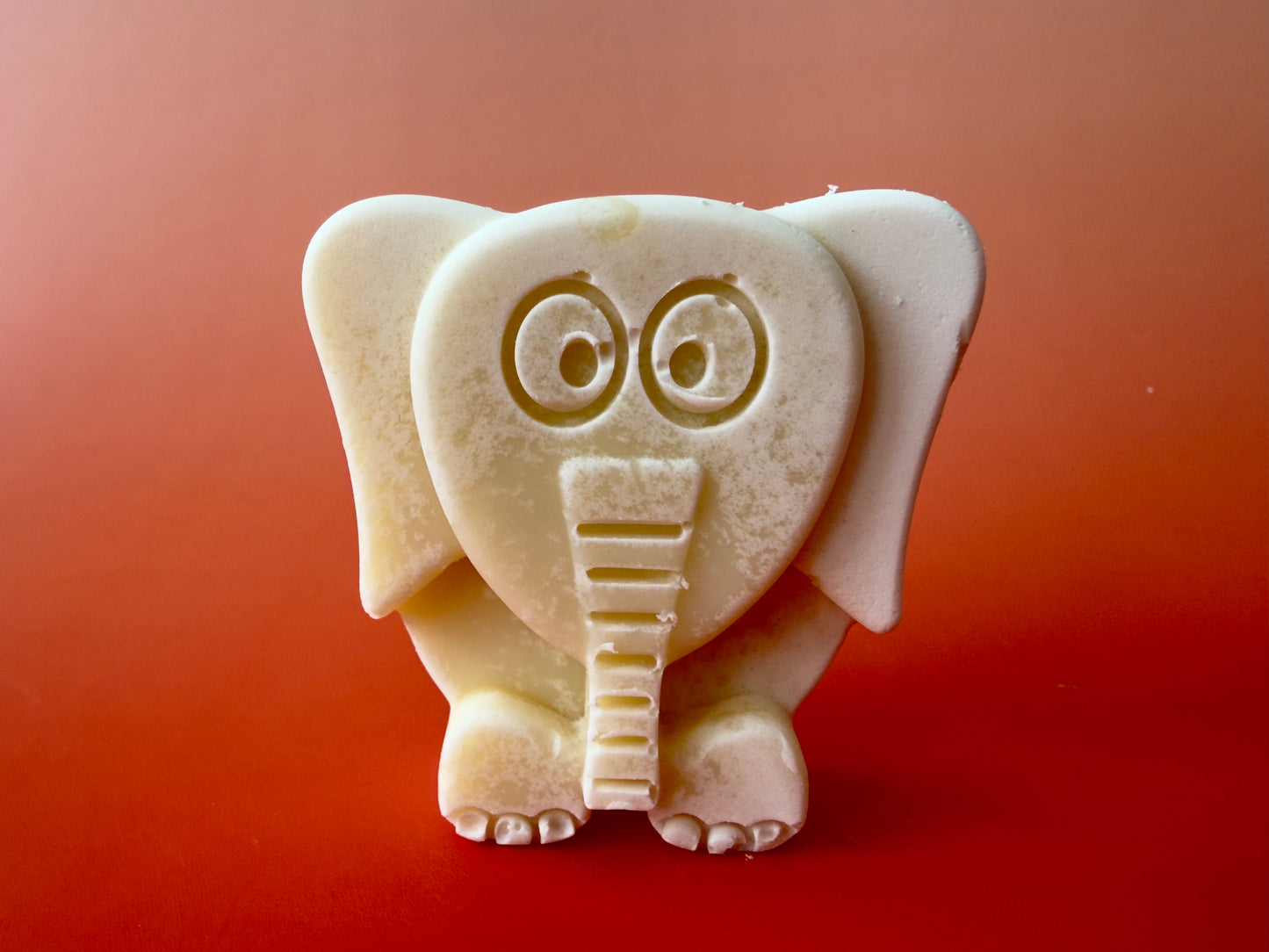 Unscented soap bar molded as a small elephant with raised details