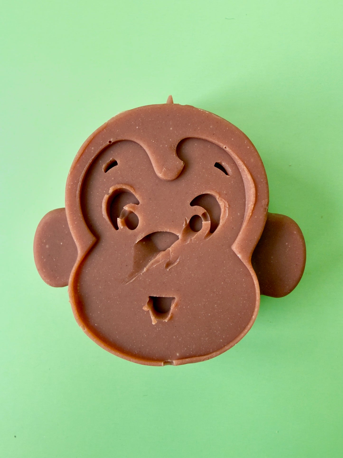 Gentle baby soap molded as a monkey face with smooth, rounded features