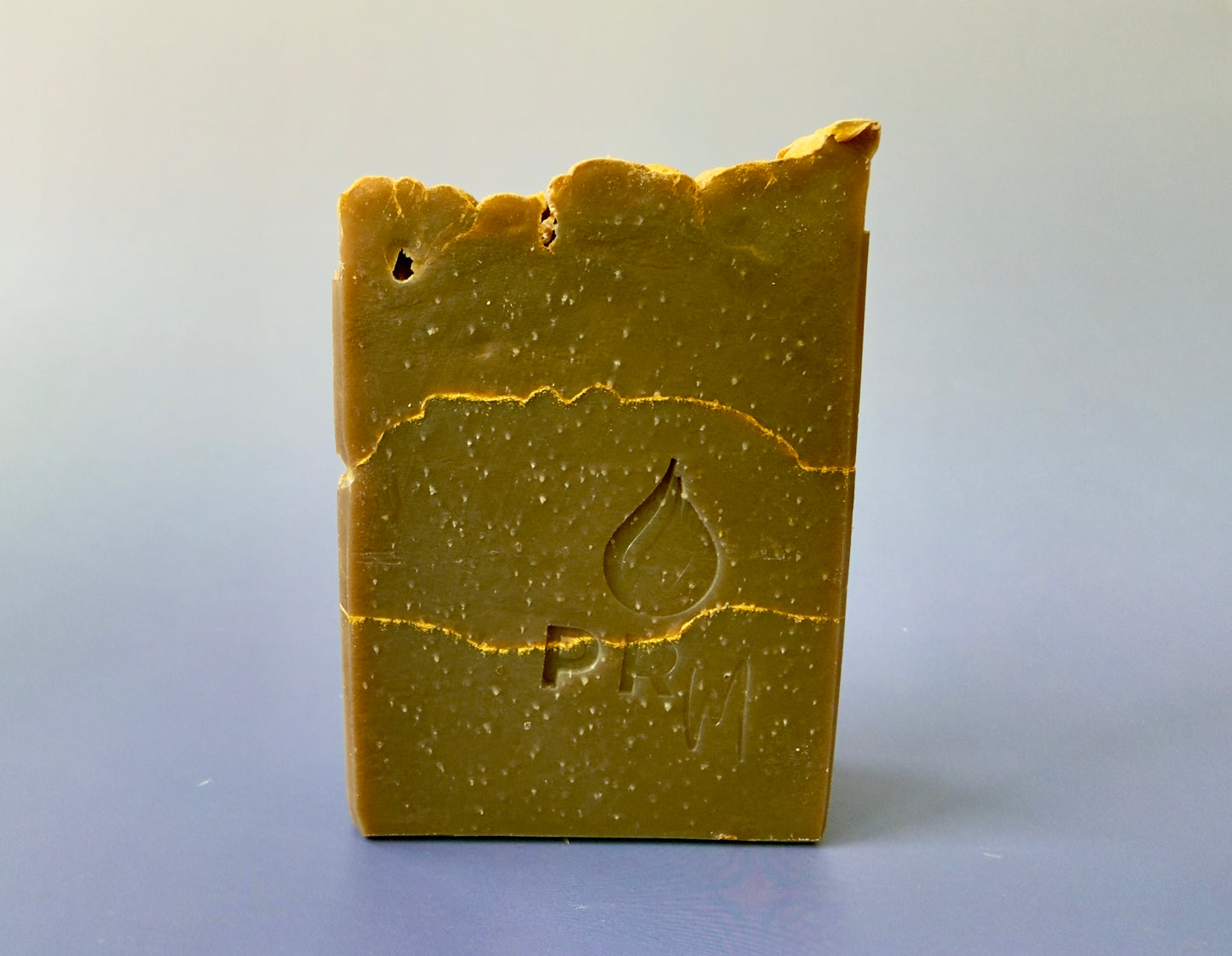 Tall almond sandalwood soap bar with gold veining and a warm beige-brown tone
