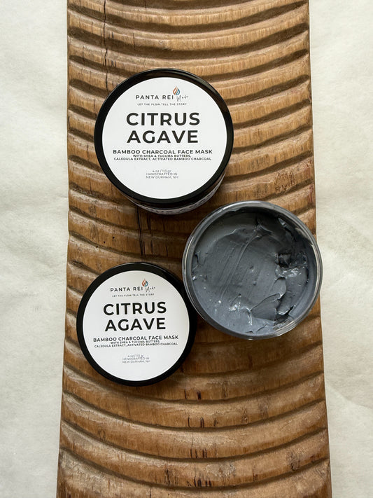 Open jar of Citrus Agave face mask showing the smooth gray charcoal mask texture.